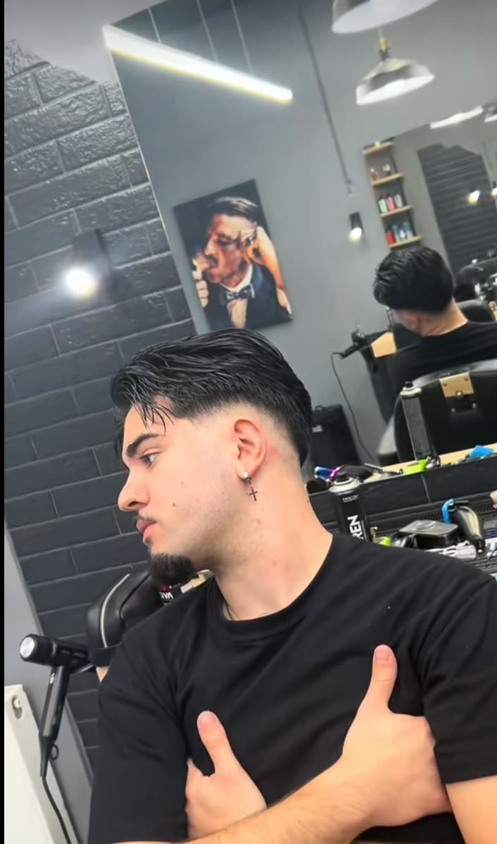 Fresh fade and styled top, side profile
